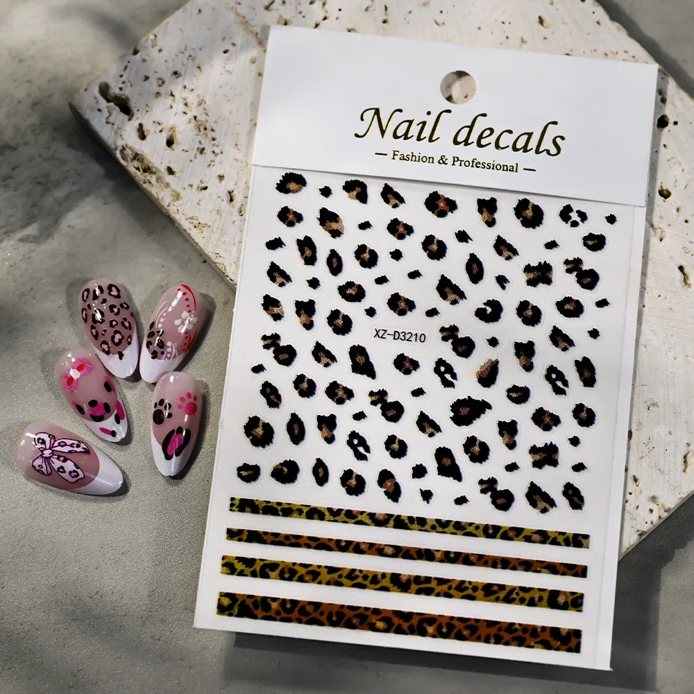 Pink and black 5D leopard print nail art stickers by Blushimmer on a transparent sheet, ready for DIY manicure decoration.