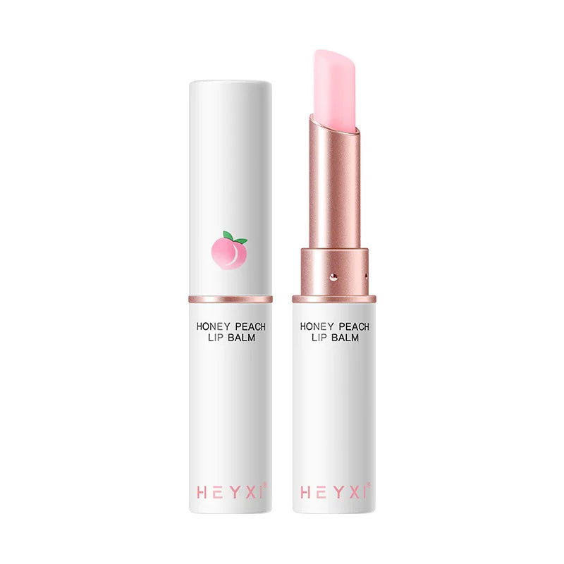 Blushimmer Honey Peach lip balm with color-changing, moisturizing, and nourishing formula on smooth lips.