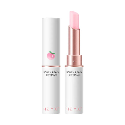 Blushimmer Honey Peach lip balm with color-changing, moisturizing, and nourishing formula on smooth lips.