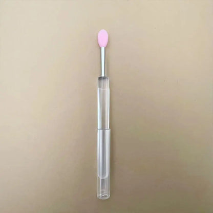 Blushimmer portable gold and silver lips makeup brush pen with metal handle, protective cap for lip gloss and lipstick application.