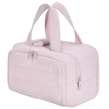 Large waterproof Blushimmer cosmetic bag with multiple compartments, ideal for travel toiletries and makeup organization.