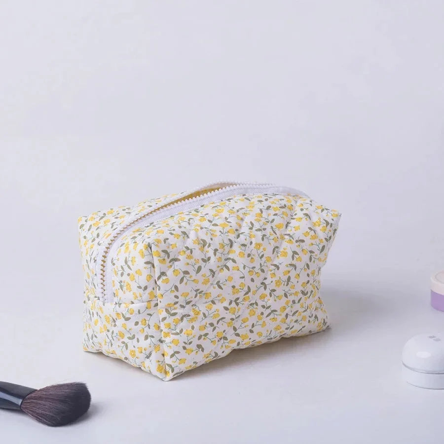 Blushimmer floral quilted makeup bag with puffy design and large travel cosmetic pouch for organizing makeup and accessories.