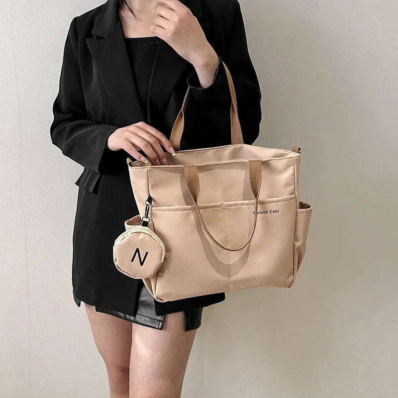 LPO Women's Khaki Oxford Tote Crossbody Shoulder Handbag with structured design and adjustable strap for versatile style.