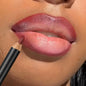 Blushimmer waterproof matte lipliner pencil in red, with long-lasting, moisturizing formula, shown with red lipstick on lips.