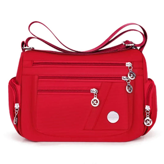 Red LPO ladies crossbody handbag with sleek design, perfect for travel and everyday accessories.