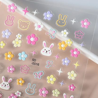Close-up of Blushimmer panda nail stickers with cartoon rabbit, flower, and animal designs for Y2K manicure decoration.