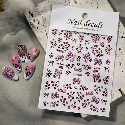 Pink and black leopard print nail art stickers from Blushimmer, 8x10cm, featuring adhesive leopard decals for DIY manicure decoration.