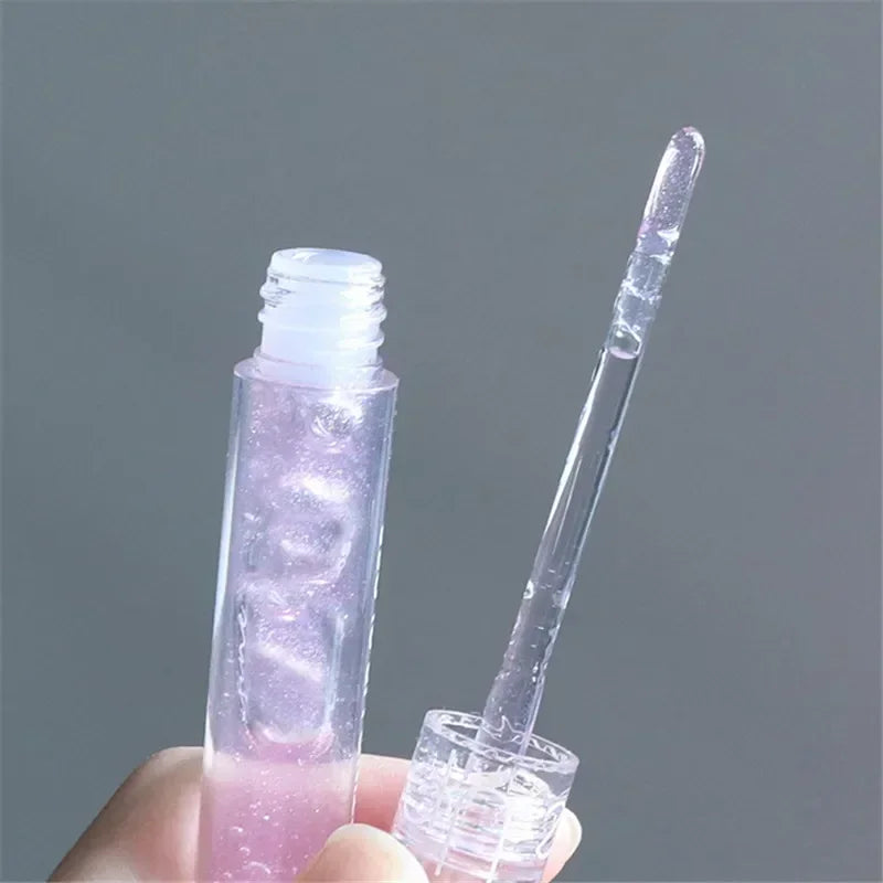 Blushimmer transparent water gloss lip glaze applied on lips, showcasing glossy, waterproof liquid lipstick and lip oil finish.