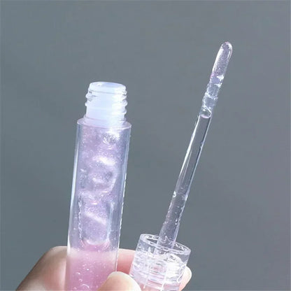 Blushimmer transparent water gloss lip glaze applied on lips, showcasing glossy, waterproof liquid lipstick and lip oil finish.