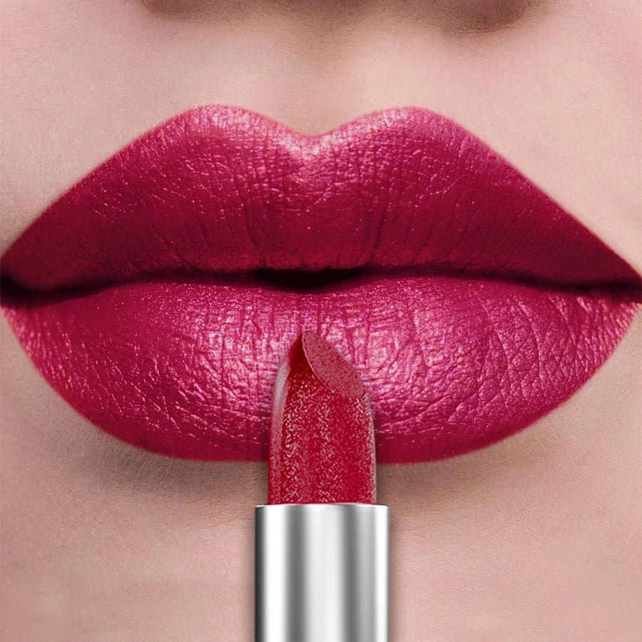 Blushimmer 21-color metallic lipstick featuring shiny, glittery, pearlescent finish in a sleek tube, perfect for bold lip makeup.