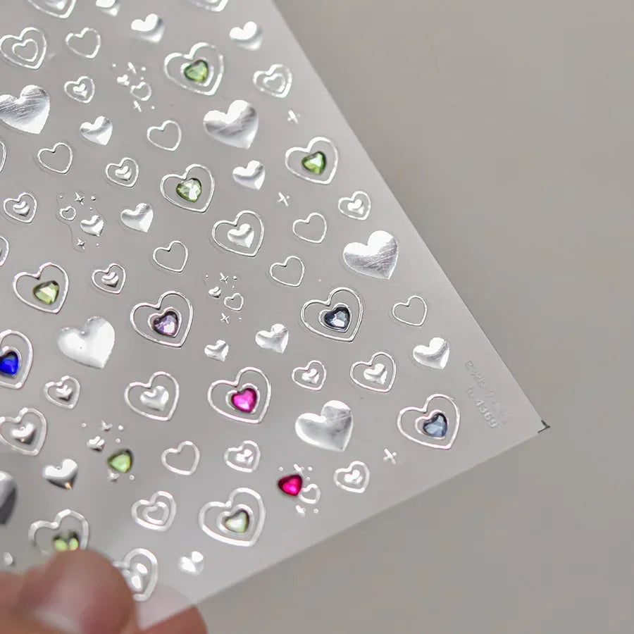 Colorful Cat's Eye 5D gradient European love heart gem nail art stickers with geometric wing crystals for manicures.