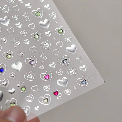Colorful Cat's Eye 5D gradient European love heart gem nail art stickers with geometric wing crystals for manicures.
