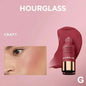 Blushimmer Lasting Natural Liquid Blush in a sleek hourglass-shaped stick with six matte, multifunctional shades for a natural glow.