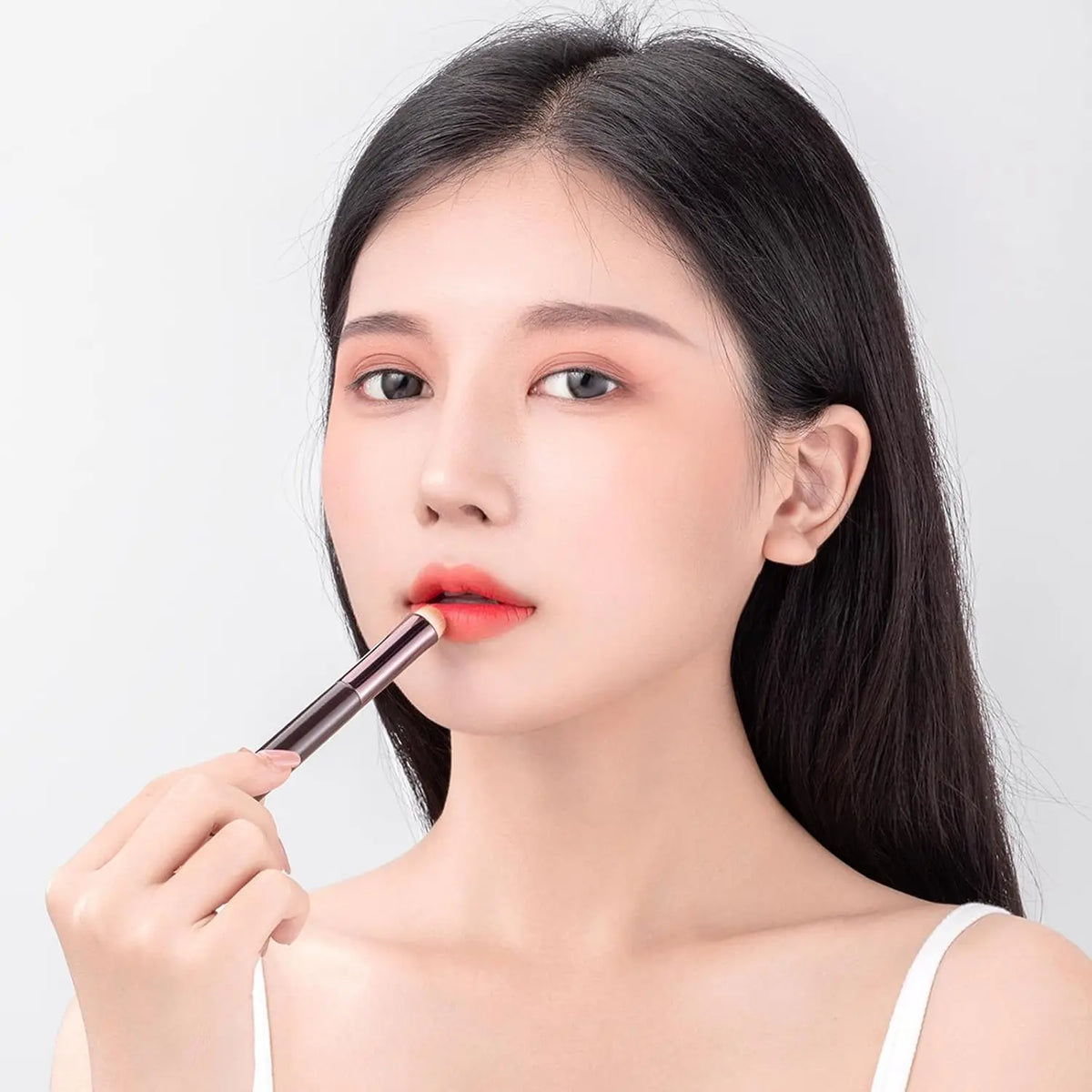Blushimmer lip brush concealer and lipstick applicator with multifunctional design for precise lip makeup application.