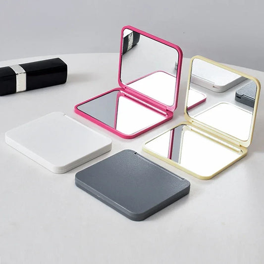 Blushimmer 2-face square portable makeup mirror with double-sided design, cute girl-themed, in multiple colors.