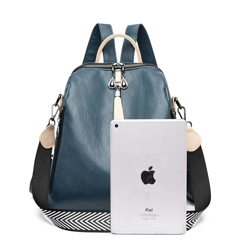 Blue women's PU leather fashion backpack by OBA with a sleek, modern design and adjustable straps, perfect for everyday use.