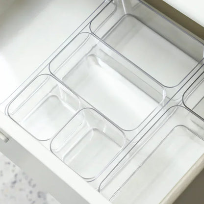 Transparent Blushimmer plastic desk storage box with multiple compartments for jewelry, makeup, and small items organizer.