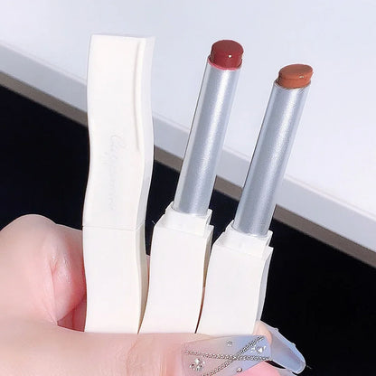 Blushimmer mirror lip gloss in a transparent tube with a pretty flower design, featuring six moisturizing nude liquid lipstick shades.