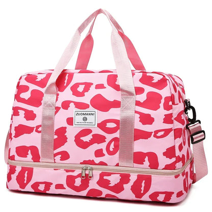 Pink women's OBA carry-on travel bag with duffel style, sturdy handles, and spacious main compartment for gym or travel use.