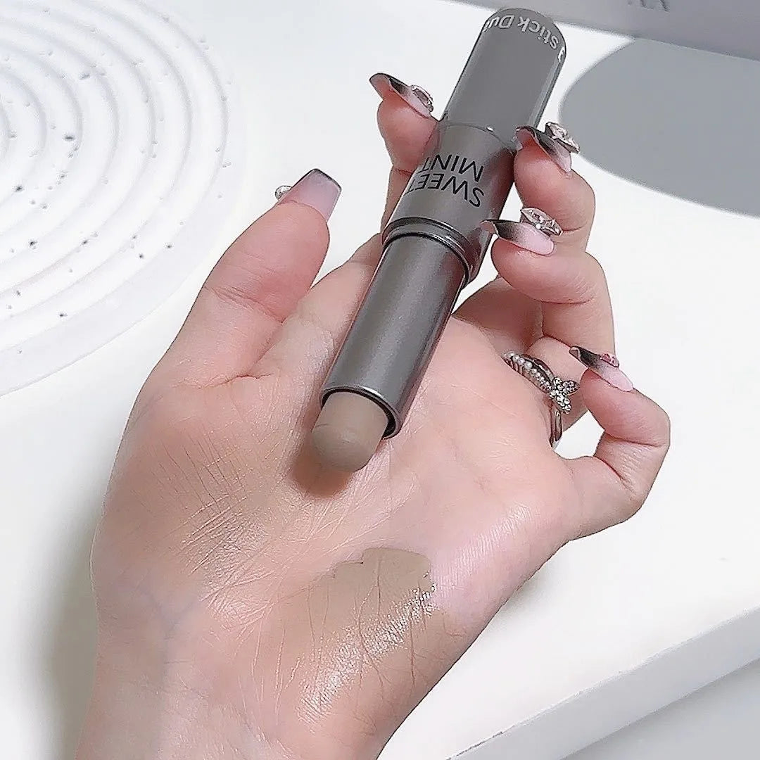 Blushimmer dual-end liquid bronzer and concealer stick with contouring and nose shading for face brightening and shaping.