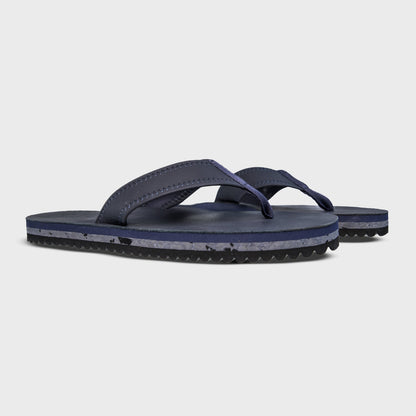 Pair of Fleks Seagrove Flip Flops in deep blue sea color, featuring a comfortable strap design and casual summer style.