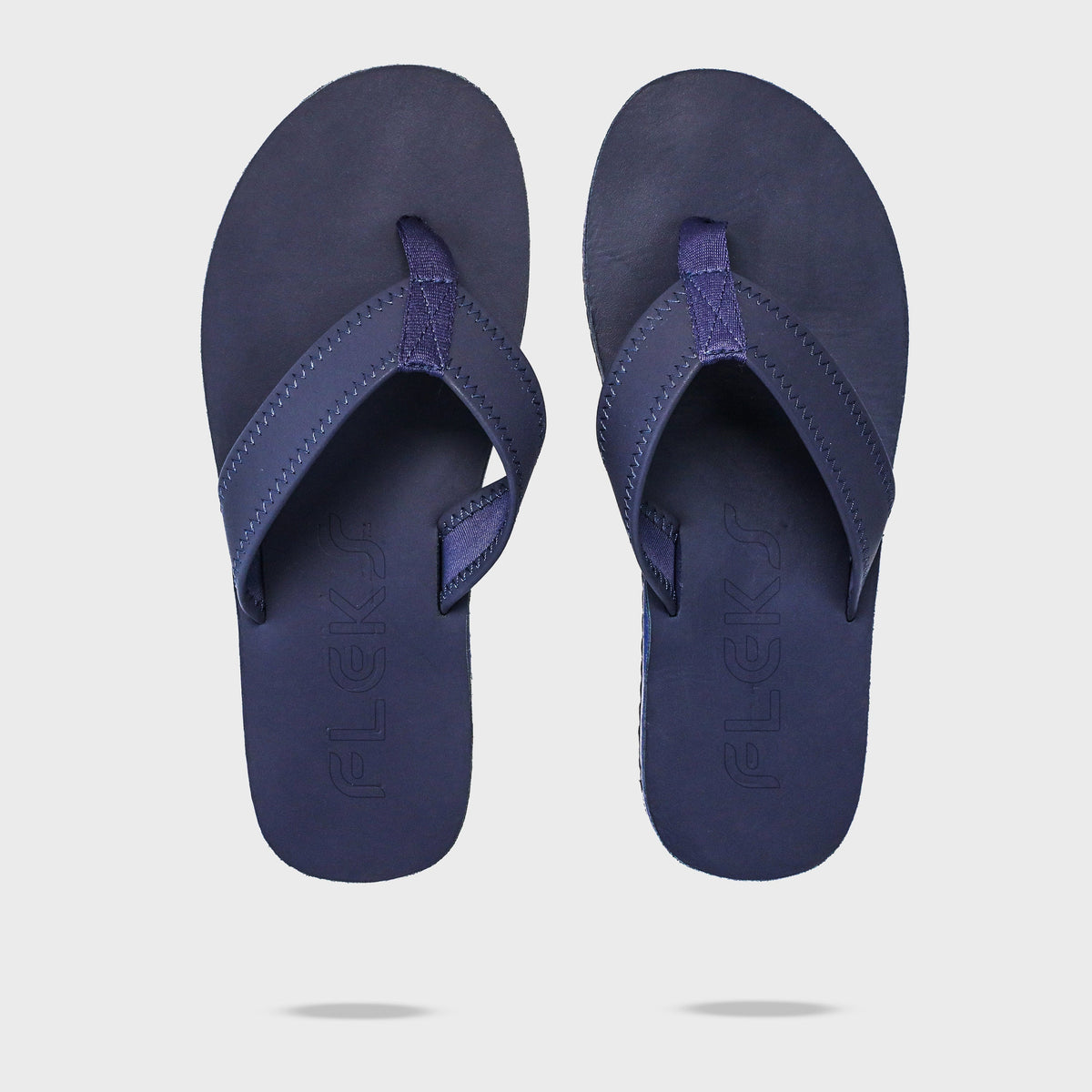Fleks Seagrove Flip Flops in deep blue sea color, top view showing the flip flop pair with logo branding.