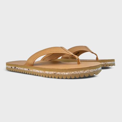 Pair of Fleks Seagrove Flip Flops in sand color, side profile view showing comfortable straps and casual summer footwear.