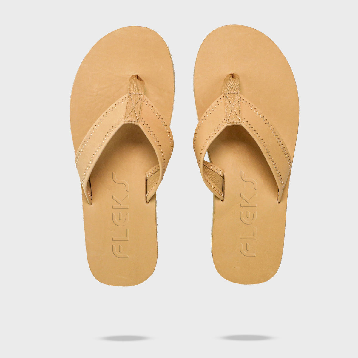 Pair of Seagrove Flip Flop sandals in sand color by Fleks, showing the top view with logo on the footbed.