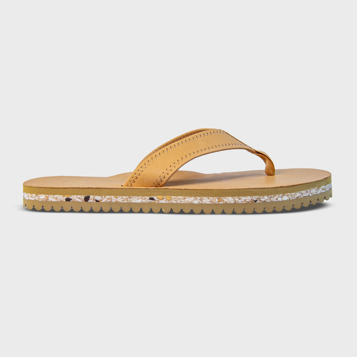 Fleks Seagrove Flip Flop in sandy color, single profile view showing casual sandal with comfortable straps and textured sole