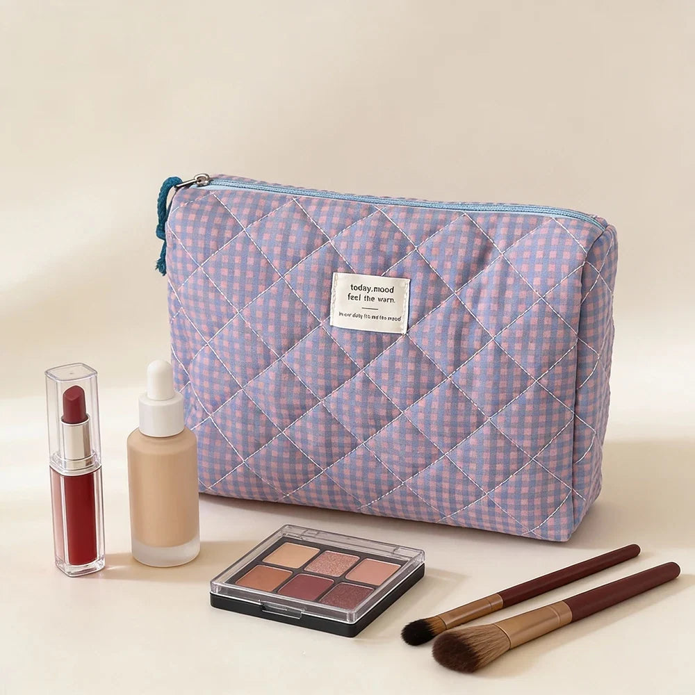 Pink Blushimmer Airfriend makeup bag with soft fabric, floral design, and zipper closure, ideal for women's travel and toiletry organization.
