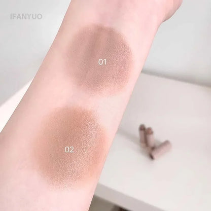 Gray and brown Blushimmer bronzer contouring stick with waterproof cream texture for face contouring and concealer application.