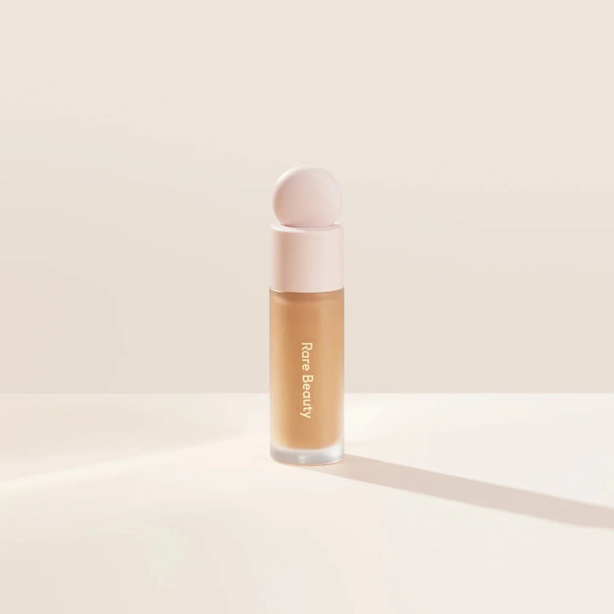 Blushimmer Rare Beauty liquid contour luminizer and blush face makeup with shimmer and shine for highlighting and contouring.
