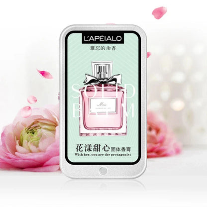 Woman body pheromone perfume solid balm by Blushimmer, featuring a long-lasting, light fragrance in a portable solid perfume container.