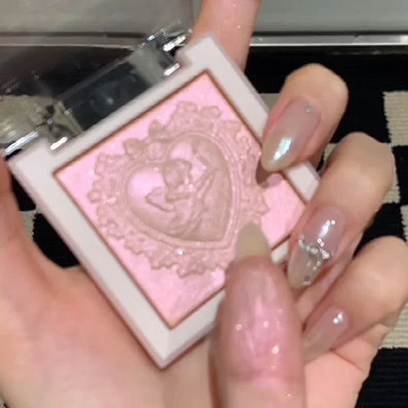 Blushimmer Love Angel high gloss powder highlighter palette with peach fairy shades, glitter bronzer, and contour illuminator makeup.