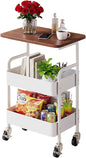Three-tier metal rolling storage cart with walnut wood tabletop, lockable wheels, ideal for kitchen, bathroom, or craft organization.