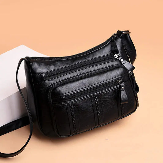 Women's OBA shoulder crossbody bag with multilayered soft leather, featuring a stylish design and adjustable strap.