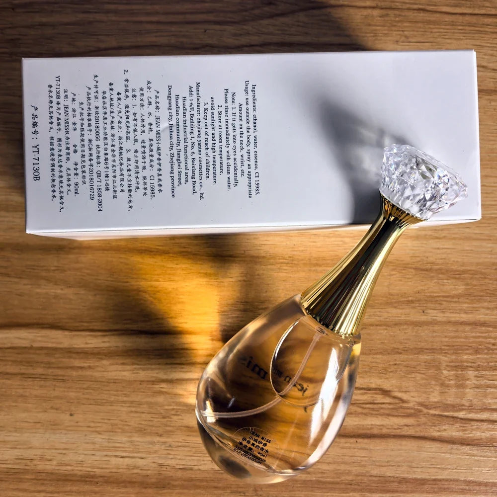 Blushimmer J'dor Eau De Parfum vaporizer spray 90ML with floral and fruity scents, long-lasting fragrance in a sleek bottle.