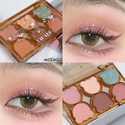 Blushimmer matte eyeshadow palette with six colors including shimmering gray, smoky black, red, and wine shades for eye makeup.