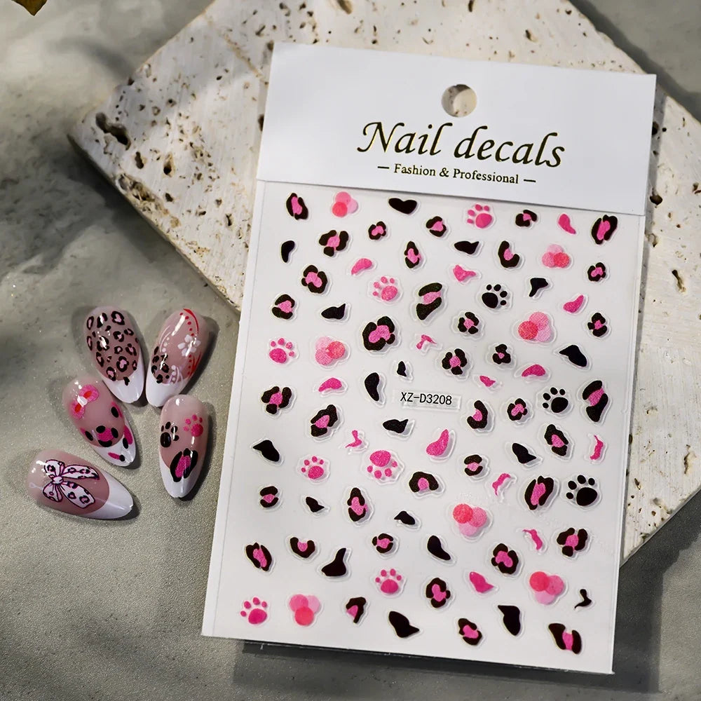 Pink leopard print nail art stickers by Blushimmer, 8x10cm sheet with pink, black, and brown leopard decals for DIY manicure decoration.
