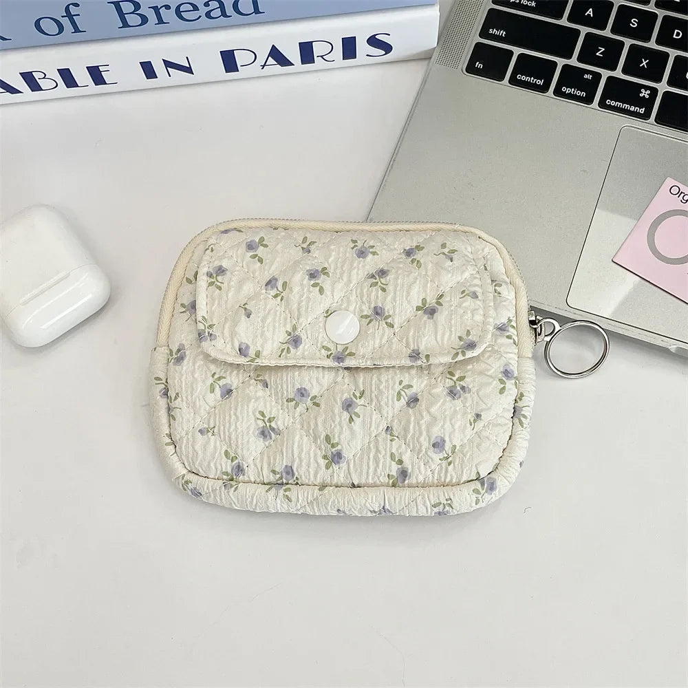 Cute cartoon Blushimmer travel cosmetic pouch with lipstick, earphone, and card storage compartments for women.