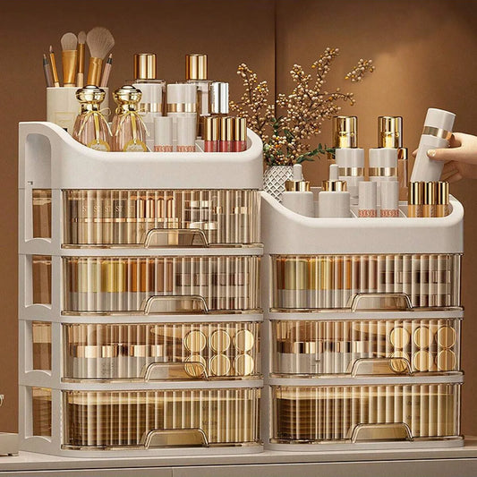 Blushimmer multi-layer makeup storage box with compartments for skincare, eyeshadow, lotions, and lipstick on a dresser or bathroom countertop.
