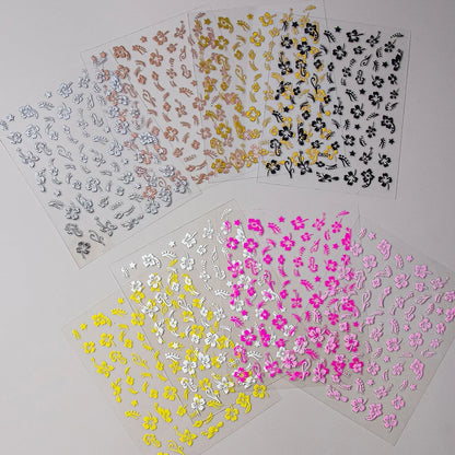 White and black 3D hibiscus flower nail sticker with pink and gold floral design, adhesive decals for nail art decoration by Blushimmer.