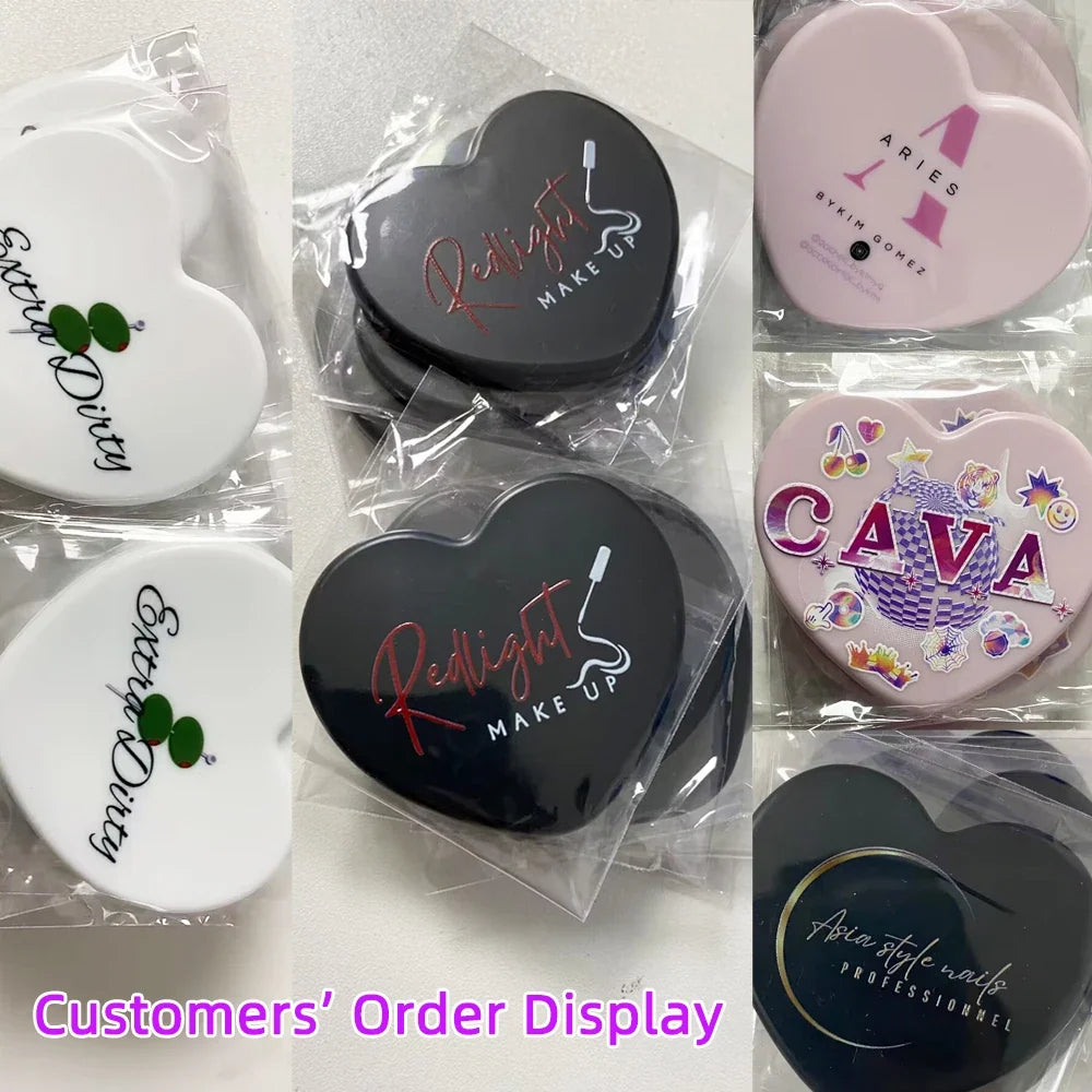 Small portable heart-shaped mirror by Blushimmer with custom logo, ideal for weddings, bridesmaids, salons, or gift ideas.