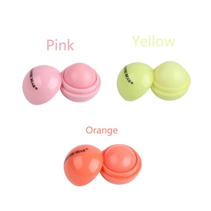 Blushimmer cute ball-shaped lip balm in pink with a non-stick cup, designed for hydrating, soothing, and long-lasting lip plumping.