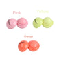Blushimmer cute ball-shaped lip balm in pink with a non-stick cup, designed for hydrating, soothing, and long-lasting lip plumping.