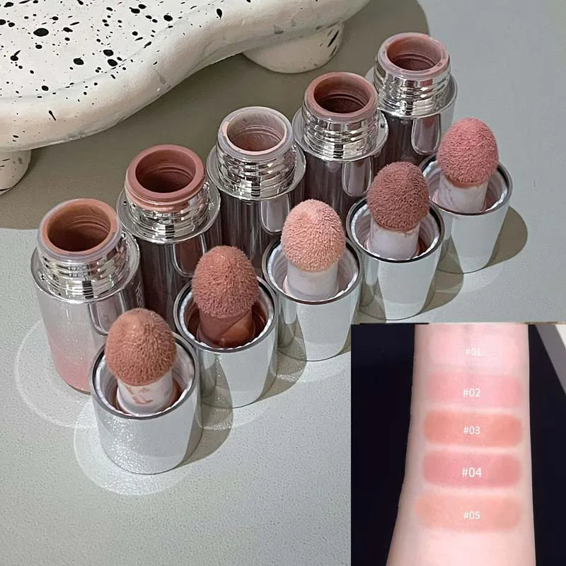 Blushimmer HERORANGE liquid blush in a natural, low-saturation matte shade, showcasing the versatile, smooth liquid formula on skin.
