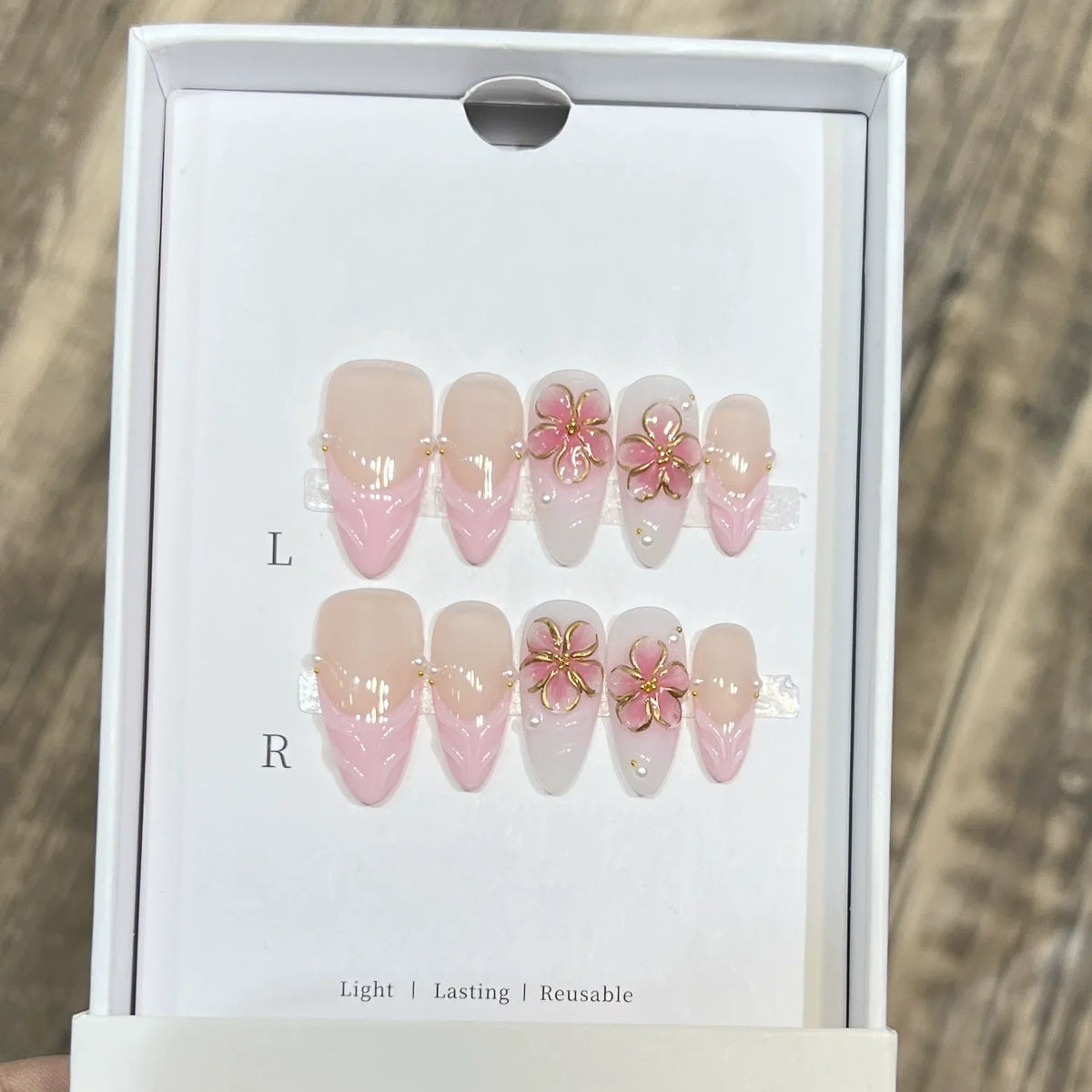 Set of 10 French almond-shaped press-on nails with flower design by Blushimmer, wearable false nails for women.