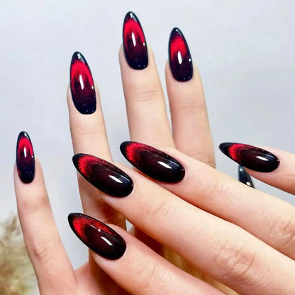 Set of 24 glossy red Cat's Eye press on nails by Blushimmer, nude-colored almond-shaped false nails with charms and detachable design.