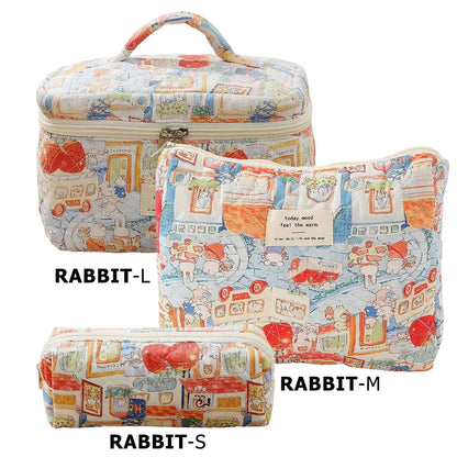 Cute quilted cotton makeup bag by Blushimmer, portable zipper cosmetic organizer with cloth hand strap, box shape for women.
