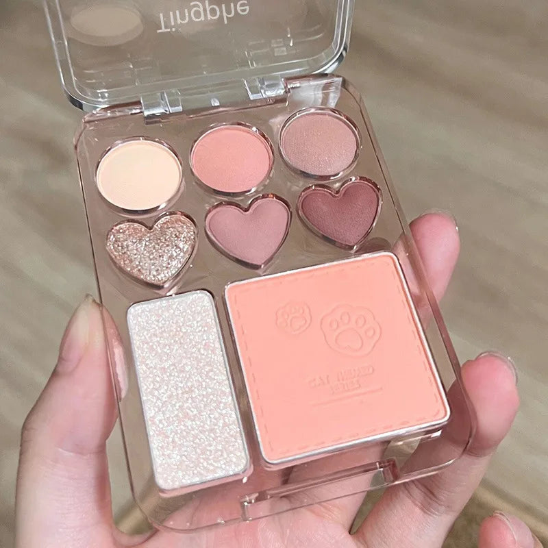 Heart-shaped eyeshadow palette with 8 pink, orange, and brightening blush and highlighter shades from Blushimmer.